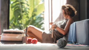 woman-knitting-blurred-unfocused-from-afar