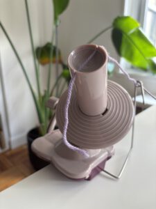 Yarn held in place by a notch in a yarn winder